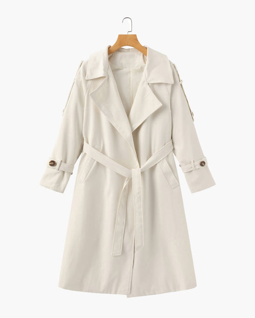 Women's classic cream belted trench coat mid-length with lapel collar, cuffed sleeves and detachable waist belt on hanger