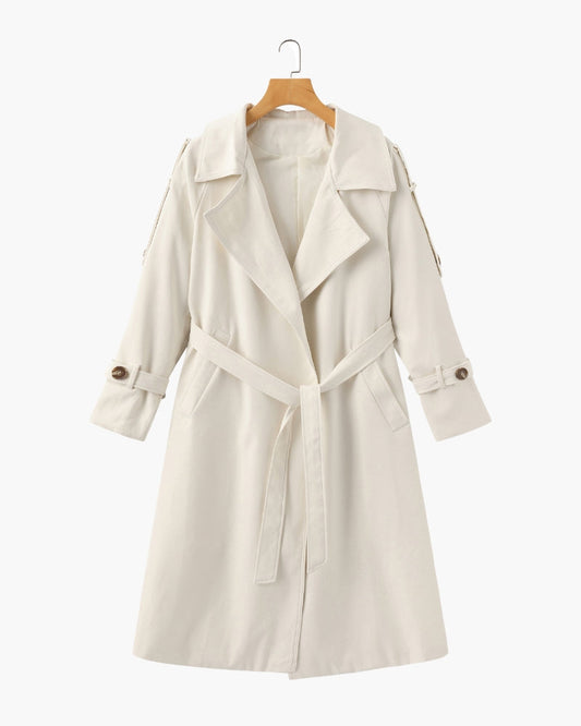 Women's classic cream belted trench coat mid-length with lapel collar, cuffed sleeves and detachable waist belt on hanger