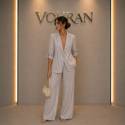 Women's striped linen blazer in beige and white — relaxed oversized fit with single button and roll-up sleeves, available at Vohran UK
