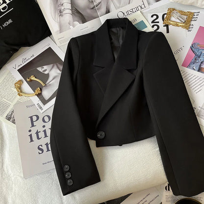 Cropped women’s blazer with double-breasted front, tailored lapels, and structured silhouette by Vohran